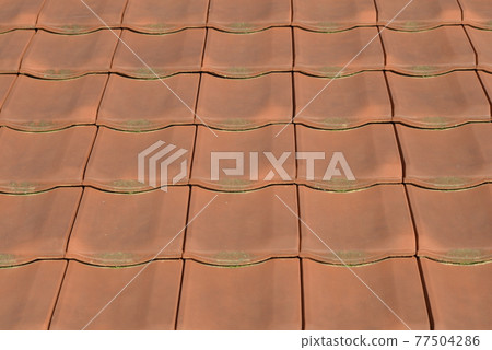 Colorful red roof tiles pattern Colorful red roof tiles pattern 77504286