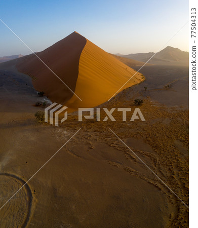 Aerial view of a dune in namibia around sossusvlei national park. 77504313