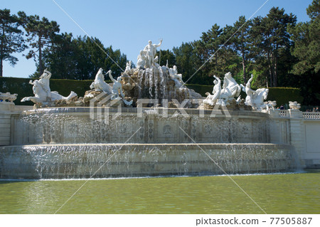VIENNA, AUSTRIA - APR 30th, 2017: Neptune Fountain Neptunbrunnen in great parterre of Schoenbrunn public park, Schoenbrunn palace - former imperial summer residence, built and remodelled during reign VIENNA, AUSTRIA - APR 30th, 2017: Neptune Fountain Neptunbrunnen in great parterre of Schoenbrunn public park, Schoenbrunn palace - former imperial summer residence, built and remodelled during reign 77505887