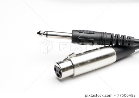 Audio cable with XLR and TRS jack connectors for microphones and professional audio equipment on a white background Audio cable with XLR and TRS jack connectors for microphones and professional audio equipment on a white background 77506482