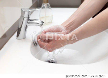 Hand washing with antibacterial soap. Personal hygiene for the prevention of coronavirus. Hand washing with antibacterial soap. Personal hygiene for the prevention of coronavirus. 77507656