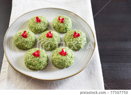 Pkhali with beans on a dark wooden background. Traditional Georgian dish of vegetables, nuts and spices 77507750