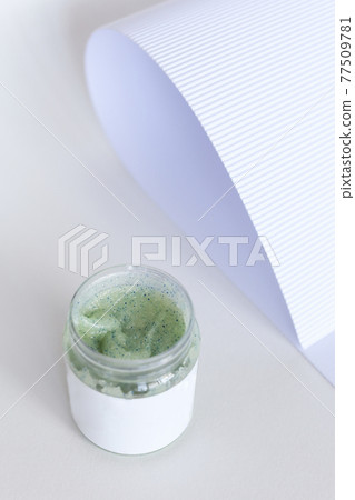 Body scrub of honey sugar peeling. Neutral Background. 77509781