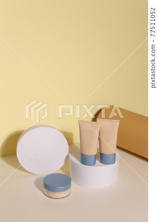 Foundation face make-up samples. Set of cosmetic liquid foundation or bb cream in bottle colour. Make up smears isolated on beige background Foundation face make-up samples. Set of cosmetic liquid foundation or bb cream in bottle colour. Make up smears isolated on beige background 77511052