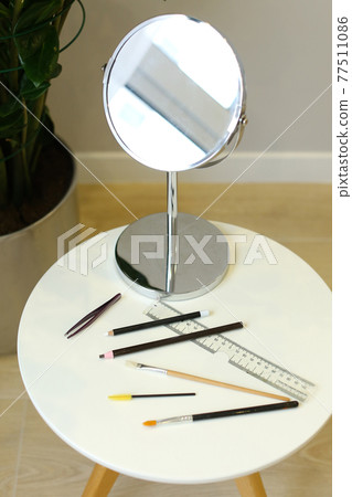 Set of professional cosmetic: make-up brushes, lipstick and brow pencil Set of professional cosmetic: make-up brushes, lipstick and brow pencil 77511086