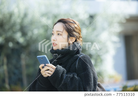 Woman in coat 77513310