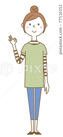 A young woman giving an OK sign 77516352