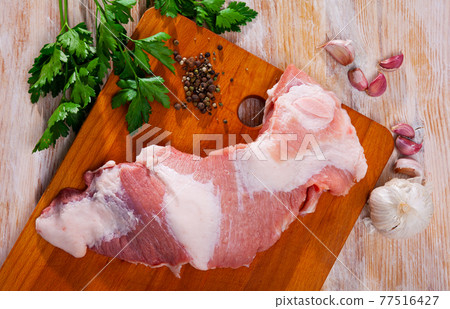 Fresh raw pork secreto fillet and condiments 77516427