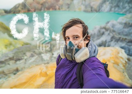 Man in respirator and inscription CH4 text from clouds at the black background. The concept of methane emissions from livestock Man in respirator and inscription CH4 text from clouds at the black background. The concept of methane emissions from livestock 77516647