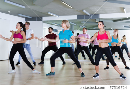 Positive people of different ages dancing 77516724