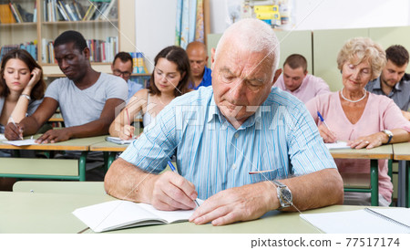 Mature man take a written exam 77517174
