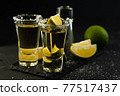 Mexican Gold Tequila with lime slices and salt. 77517437