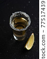 Gold Mexican Tequila shot with lime slice and salt. 77517439