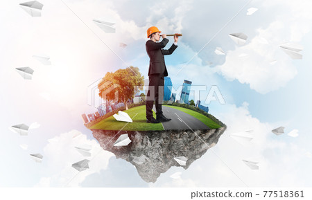 Builder man and modern city as concept of eco green construction 77518361