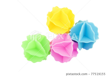 plastic balls for washing clothes in the washing machine on white background. 77519155