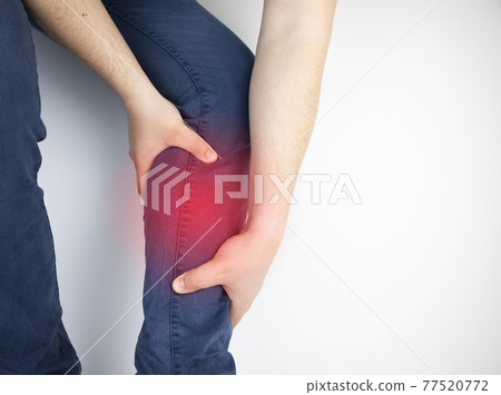 A man suffers from pain in the calves. Stretching the calf muscle, varicose veins, leg cramps, or myositis. Orthopedic doctor examines 77520772