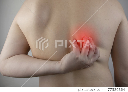 Shoulder pain. A man at a doctor appointment with a vertebrologist complaining of pain in the interscapular region and back. Shoulder pain. A man at a doctor appointment with a vertebrologist complaining of pain in the interscapular region and back. 77520864