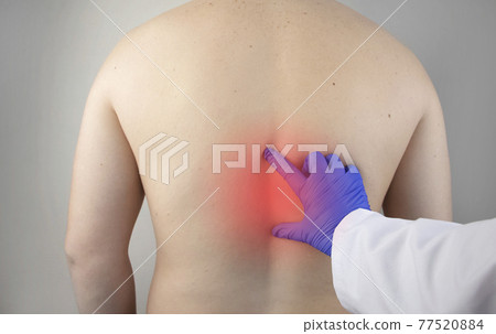 Pain in the spine. A man at the doctor appointment with a neurologist and vertebrologist. Diseases of the back: pinched nerve, intervertebral hernia, or osteochondrosis Pain in the spine. A man at the doctor appointment with a neurologist and vertebrologist. Diseases of the back: pinched nerve, intervertebral hernia, or osteochondrosis 77520884