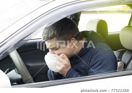 A ride during a car trip. The driver suffers from kinetosis, motion sickness. The concept of motion sickness in transport and vestibular apparatus disease A ride during a car trip. The driver suffers from kinetosis, motion sickness. The concept of motion sickness in transport and vestibular apparatus disease 77522268