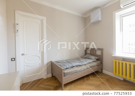 Simple interior of modern bedroom with bed 77525933