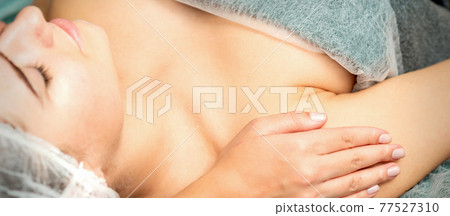 Therapist making massage of shoulders Therapist making massage of shoulders 77527310