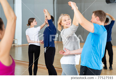 Middle aged woman practicing bachata 77527593