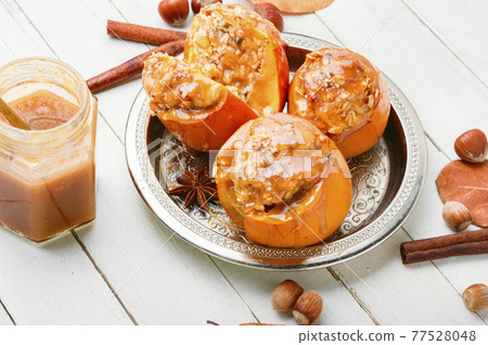 Baked stuffed persimmon 77528048