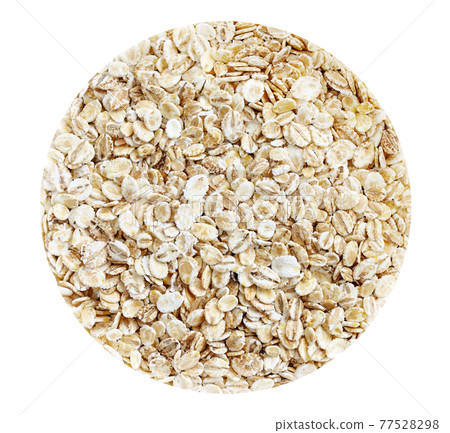 Organic barley flakes isolated on white circle background. Organic barley flakes isolated on white circle background. 77528298