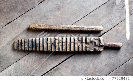 Household item was used for knocking out washing and ironing clothes. The hand-wrung linen was wound on a roller or rolling pin and rolled out with a ruber. Ancient thing Household item was used for knocking out washing and ironing clothes. The hand-wrung linen was wound on a roller or rolling pin and rolled out with a ruber. Ancient thing 77529421