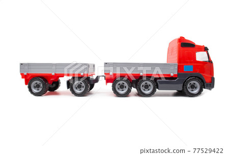 Childrens red toy, truck with a trailer on a white background, isolate 77529422
