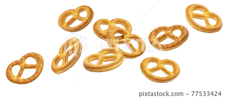 Falling salted pretzels isolated on white background 77533424
