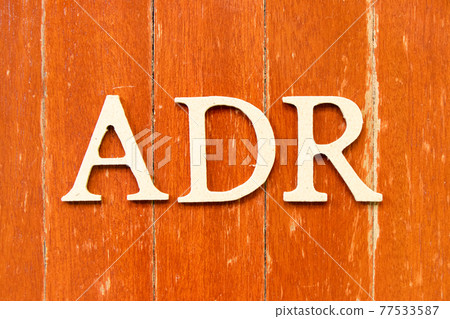 Alphabet letter in word ADR (Abbreviation of adverse drug reaction) on old red color wood plate background Alphabet letter in word ADR (Abbreviation of adverse drug reaction) on old red color wood plate background 77533587