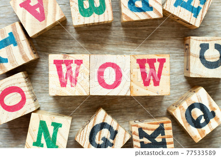 Alphabet letter block in word wow with another on wood background Alphabet letter block in word wow with another on wood background 77533589