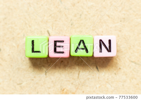 Color alphabet letter block in word lean on wood background 77533600