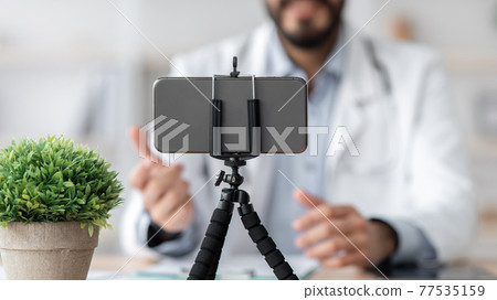 Virtual doctor consulting patient at home. Online telemedicine chat, visit, meeting, telehealth 77535159