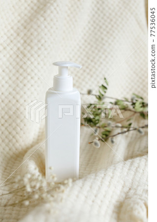 White Plastic dispenser bottles with body cream White Plastic dispenser bottles with body cream 77536045