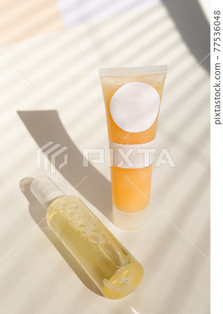 Eco friendly Bottle and tube with natural skincare cosmetics, creams or oils on light background. Plant-based beauty products 77536048