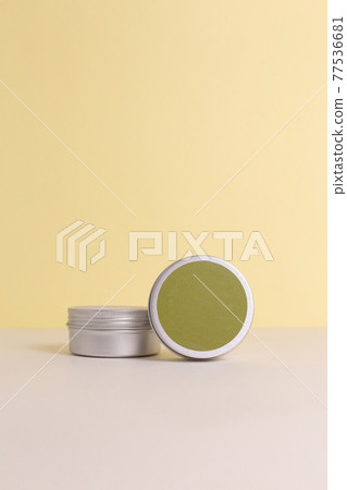 Aluminum round jar for cosmetics. Metalic cosmetic bottles. Blank mock up advertising container with copy space. Aluminum round jar for cosmetics. Metalic cosmetic bottles. Blank mock up advertising container with copy space. 77536681