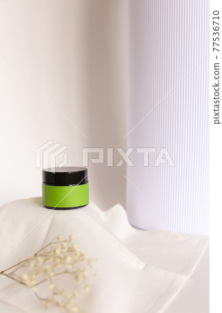 Blank cosmetic products on neutral background. Green Place for your text. Blank cosmetic products on neutral background. Green Place for your text. 77536710