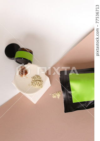 Blank cosmetic products on neutral background. Green Place for your text. 77536713