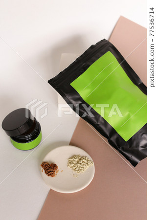 Blank cosmetic products on neutral background. Green Place for your text. Blank cosmetic products on neutral background. Green Place for your text. 77536714