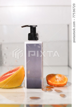 Beauty natural skincare products development concept. Dermatologist cosmetic skincare bottle with pump dispenser and organic ingredient on neutral background. 77536720