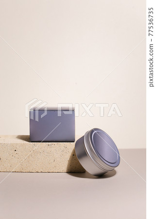 White cream in round aluminum metal tin on neutral background. Natural cosmetic product. Face and body skin care, cosmetic products. White cream in round aluminum metal tin on neutral background. Natural cosmetic product. Face and body skin care, cosmetic products. 77536735