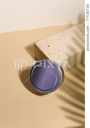 White cream in round aluminum metal tin on neutral background. Natural cosmetic product. Face and body skin care, cosmetic products. White cream in round aluminum metal tin on neutral background. Natural cosmetic product. Face and body skin care, cosmetic products. 77536736