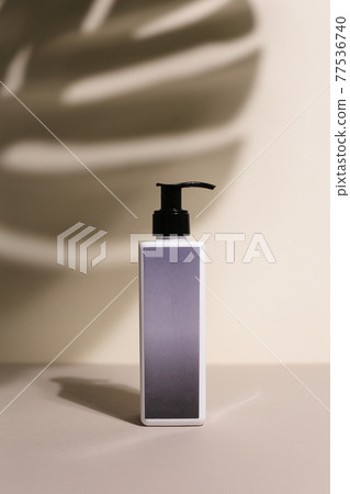 Beauty natural skincare products development concept. Dermatologist cosmetic skincare bottle with pump dispenser and organic ingredient on neutral background. Beauty natural skincare products development concept. Dermatologist cosmetic skincare bottle with pump dispenser and organic ingredient on neutral background. 77536740
