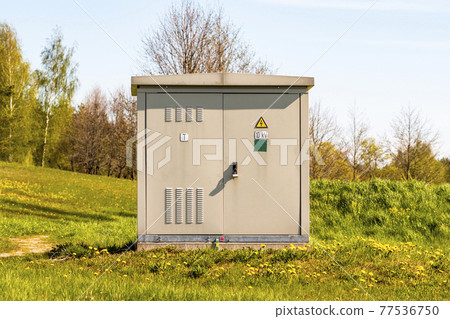 Outdoor electric high voltage cabinet on a sunny spring day Outdoor electric high voltage cabinet on a sunny spring day 77536750
