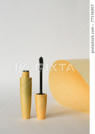 Isolated mascara on neutral backfround. Open with brush, black 77536907