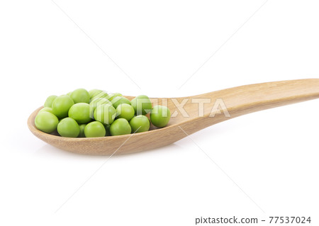 Green peas in wooden spoon isolated on white background. Is a food of antioxidants. Green peas in wooden spoon isolated on white background. Is a food of antioxidants. 77537024