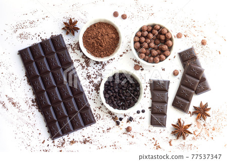 Chocolate bar and pieces with ingredients for cooking sweet food isolated top view 77537347
