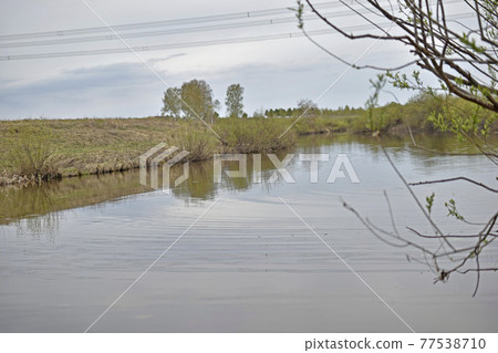 River in the Urals in spring with hilly terrain River in the Urals in spring with hilly terrain 77538710